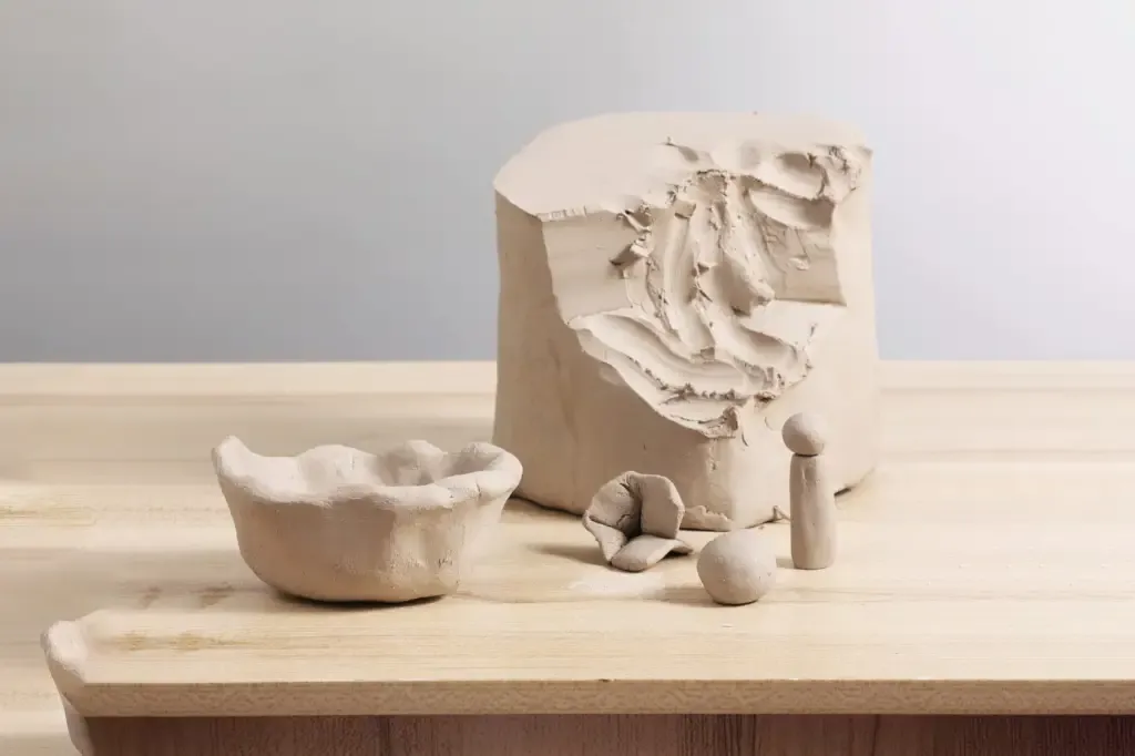 Raw clay forms on a workbench